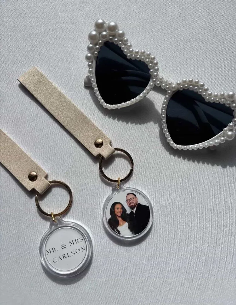 Custom acrylic photo keychains with leather straps for wedding guests
